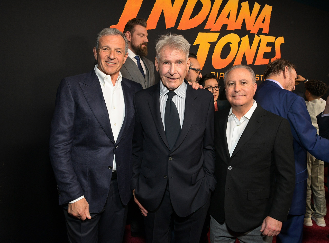 (L-R) Bob Iger, CEO, Walt Disney Company, Harrison Ford and Alan Bergman, Chairman, Disney Studios Content, attend the Indiana Jones and the Dial of Destiny U.S. Premiere at the Dolby Theatre in Hollywood, California on June 14, 2023.