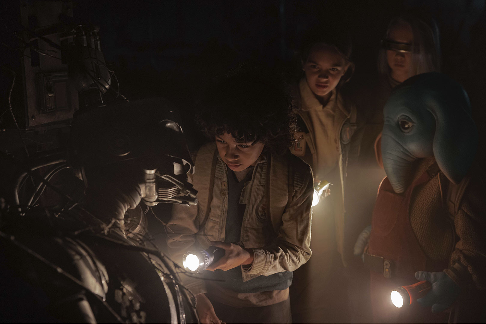 (L-R): SM-33 (voiced by Nick Frost), Wim (Ravi Cabot-Conyers), Fern (Ryan Kiera Armstrong), KB (Kyriana Kratter), and Neel (Robert Timothy Smith) in Lucasfilm's Star Wars: Skeleton Crew.