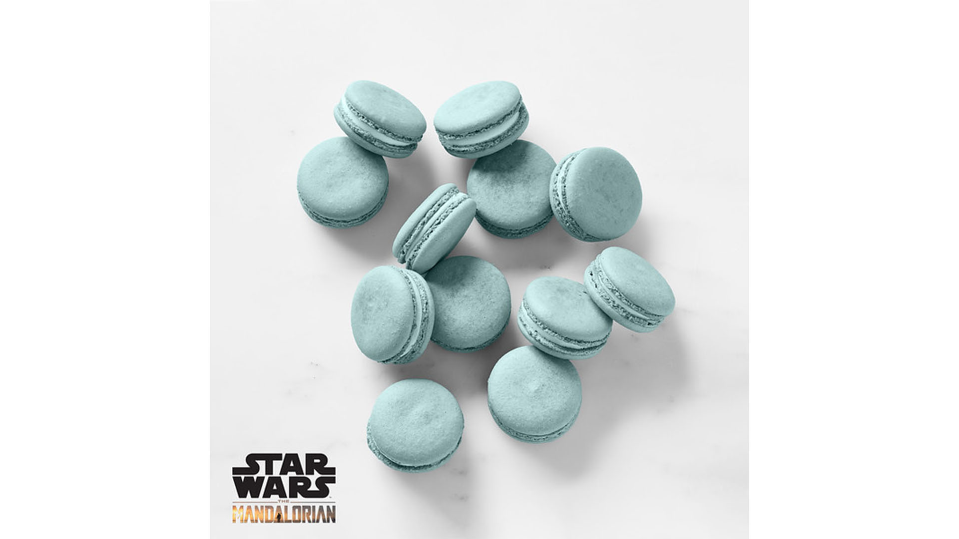 A pile of William Sonoma's blue Navarro Nummies, macarons inspired by Star Wars: The Mandalorian