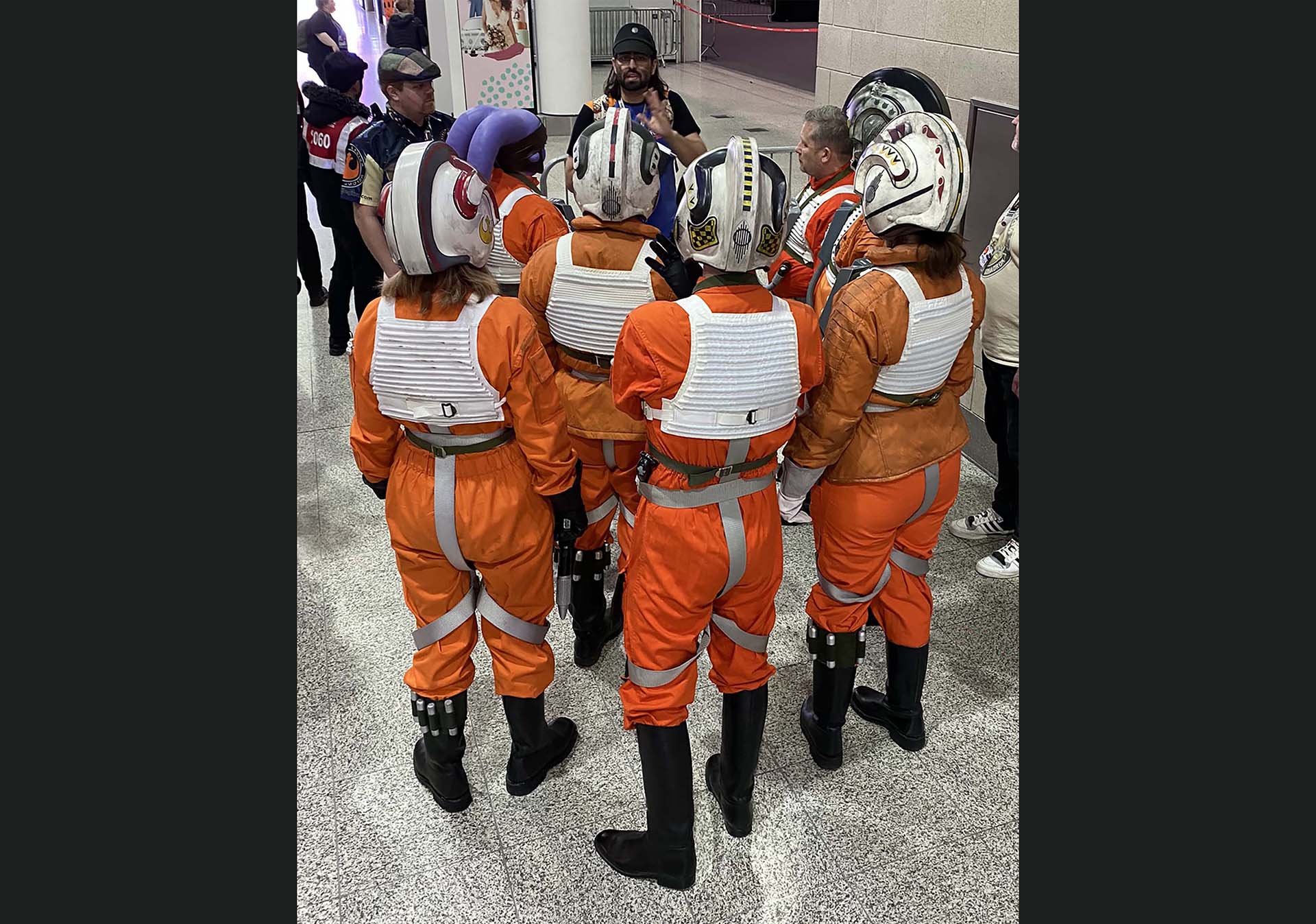 Vargas briefs members of the Rebel Legion in X-wing flight suits
