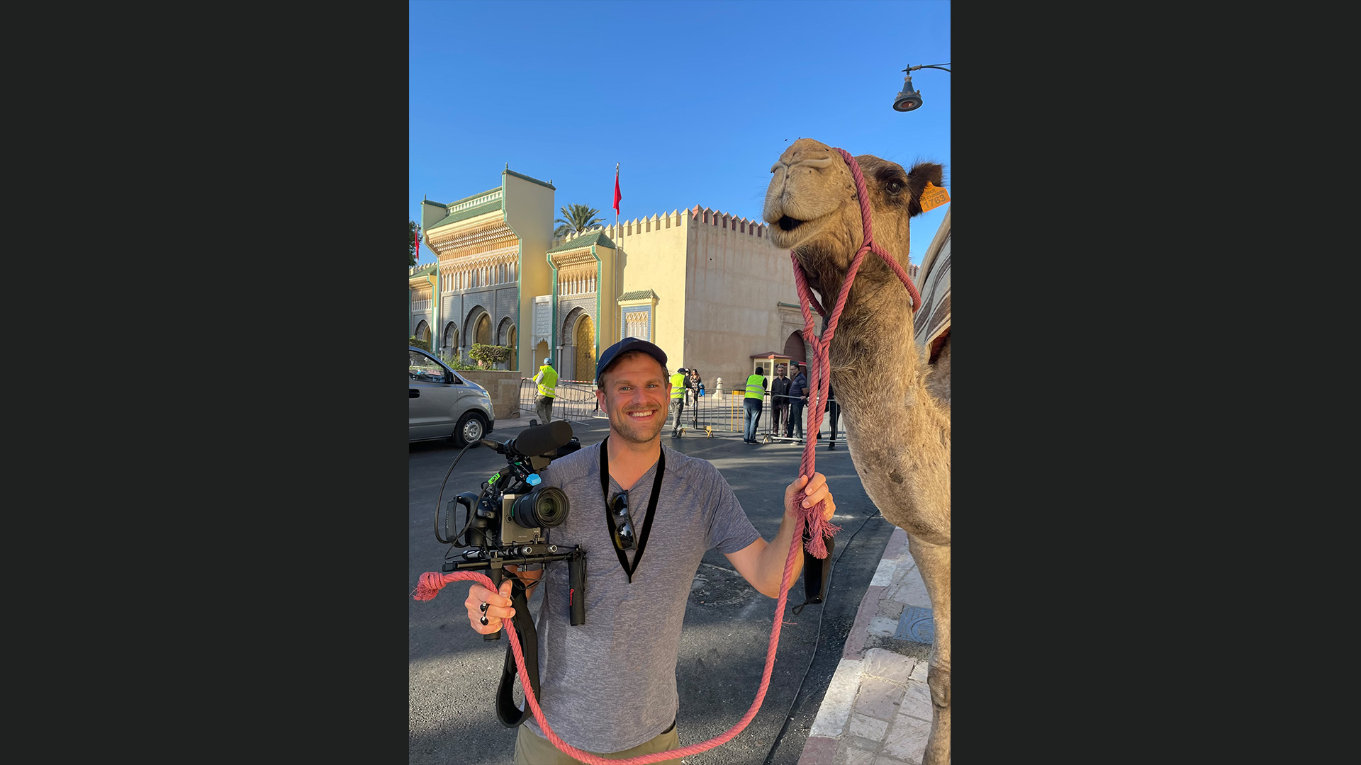 Ian Bucknole with a camel on location in Morocco.