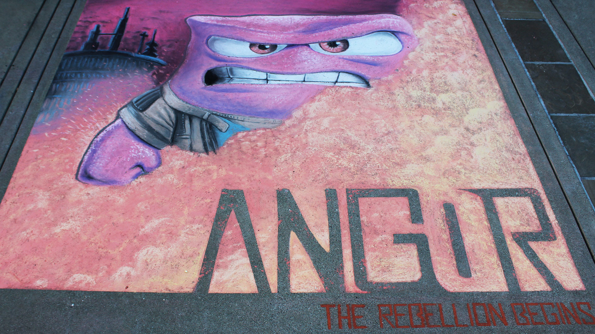 Chalk art featuring Anger from Inside Out as 