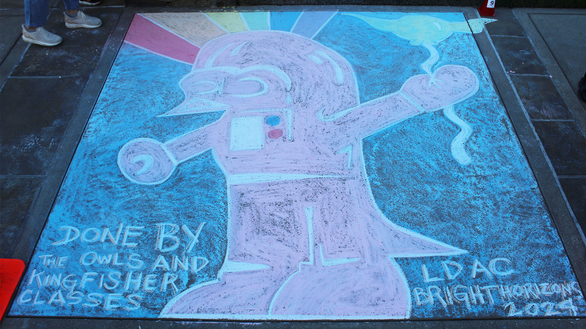 Chalk art of Darth Vader and a rainbow created by a local day-care class.