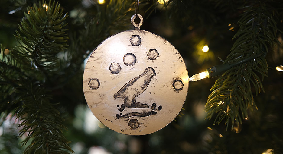 The finished medallion hanging on a Christmas tree.