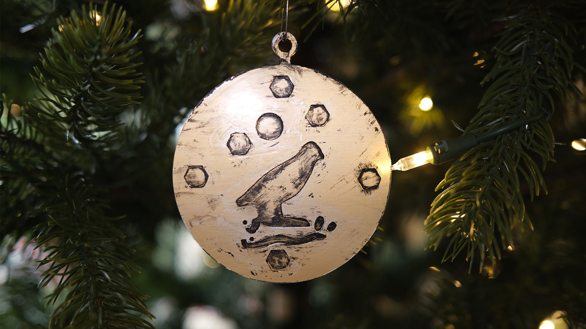 The finished medallion hanging on a Christmas tree.