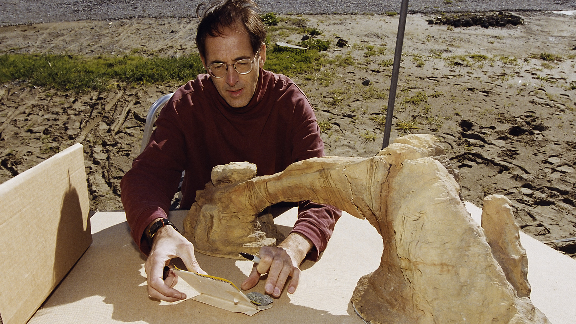 Artist Paul Huston prepares a rock arch miniature.