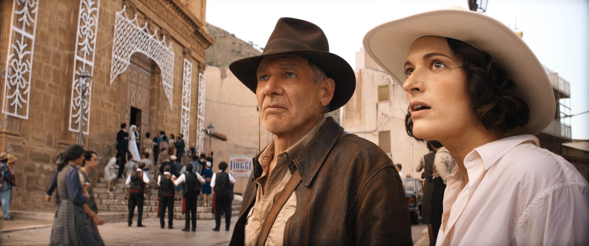 (L-R): Indiana Jones (Harrison Ford) and Helena (Phoebe Waller-Bridge) in Lucasfilm's INDIANA JONES AND THE DIAL OF DESTINY. ©2023 Lucasfilm Ltd.