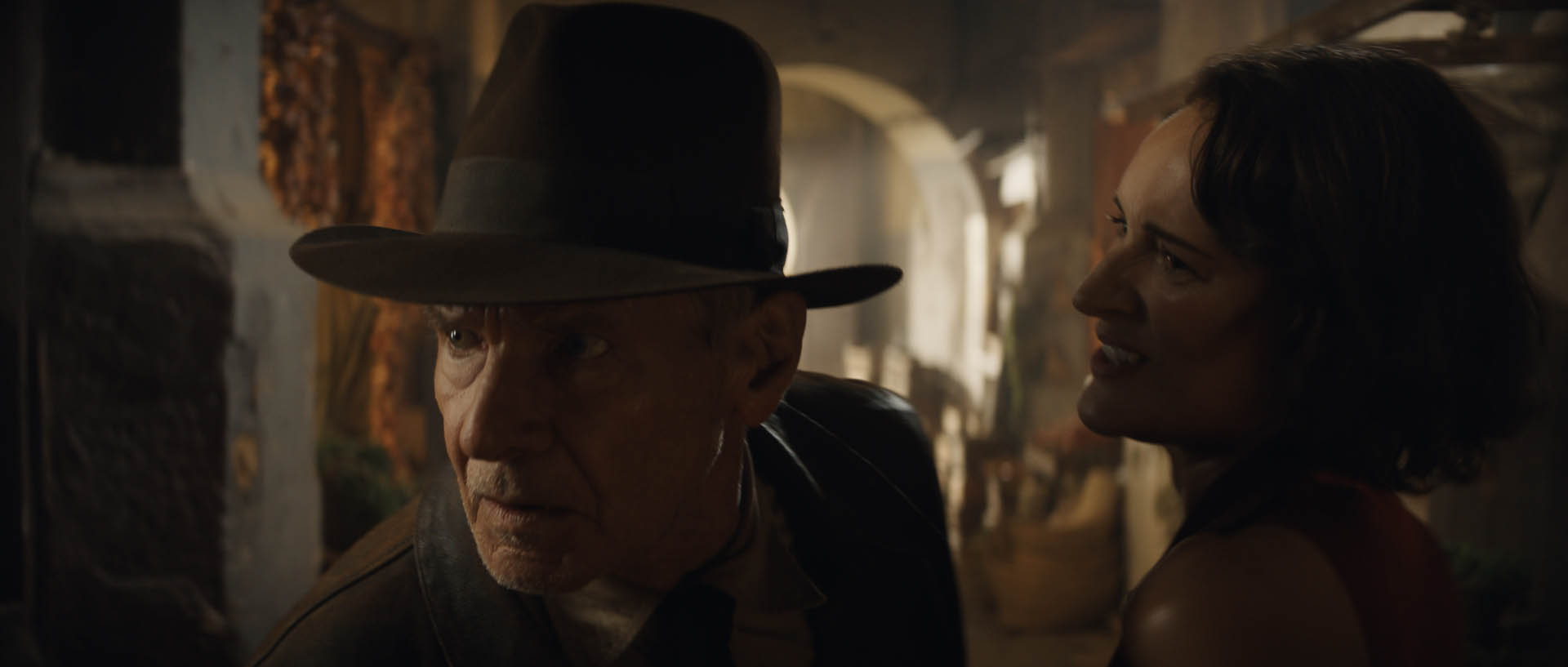 (L-R): Indiana Jones (Harrison Ford) and Helena (Phoebe Waller-Bridge) in Lucasfilm's INDIANA JONES AND THE DIAL OF DESTINY. ©2022 Lucasfilm Ltd.