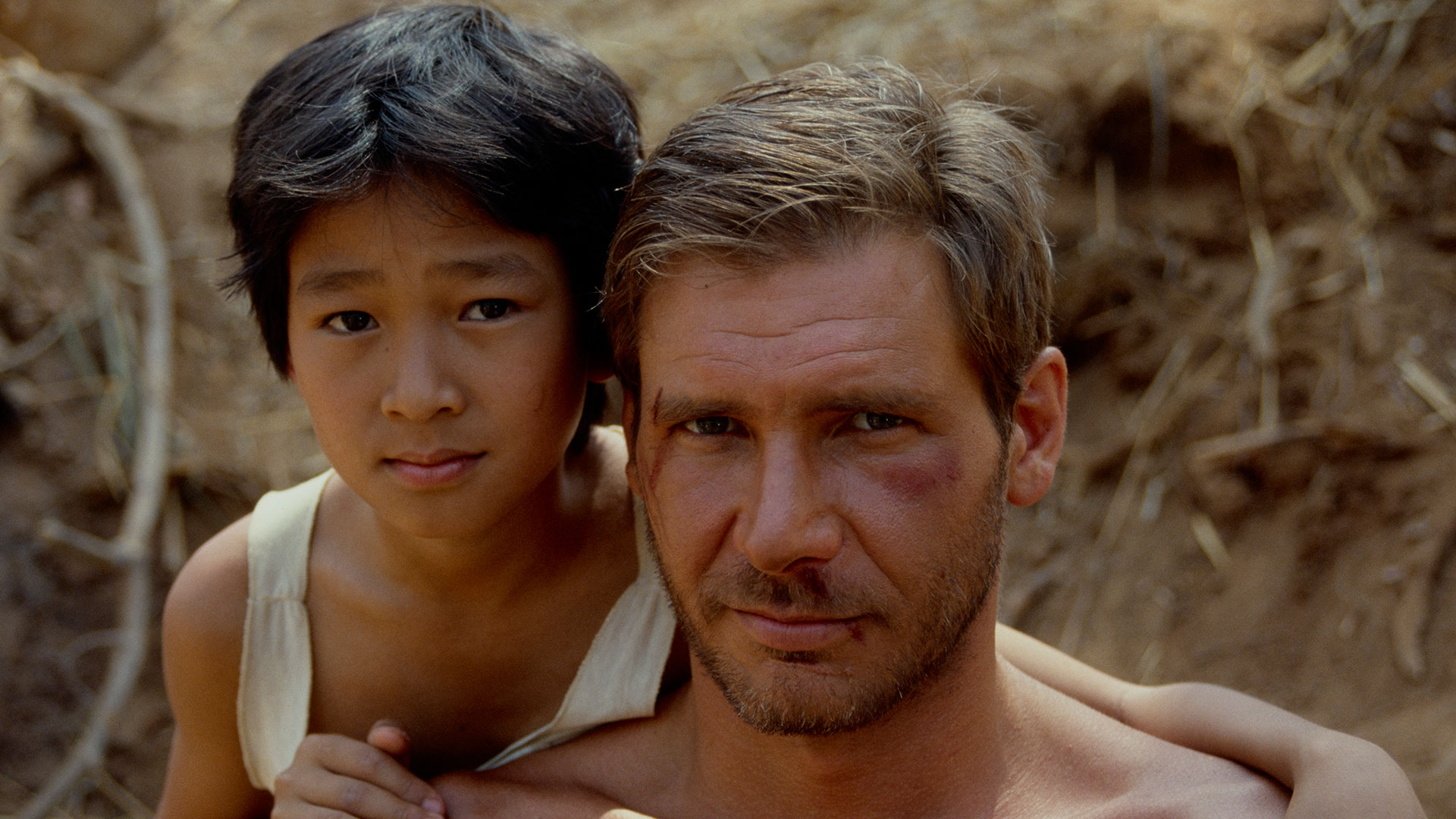 Ke Huy Quan and Harrison Ford on location of Indiana Jones and the Temple of Doom.