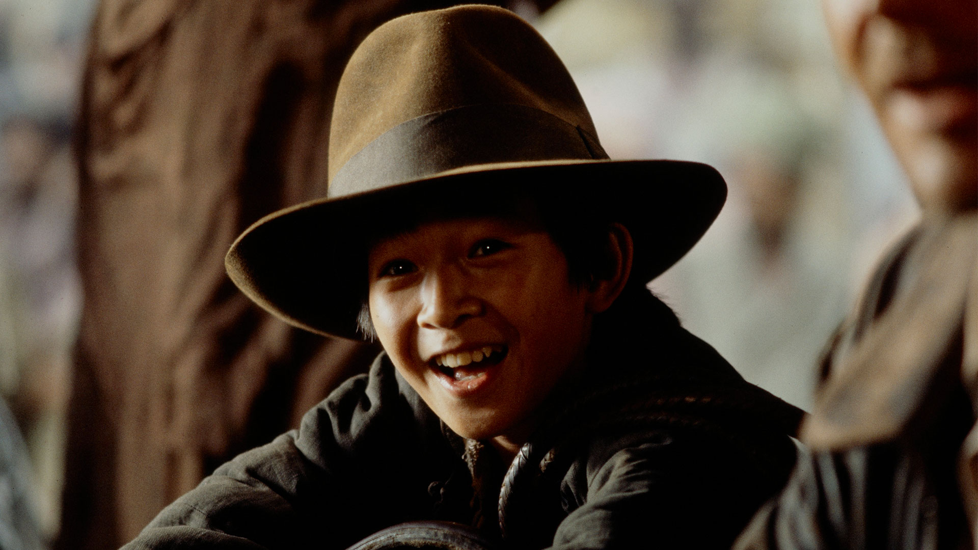 Short Round wears Indy's fedora in Indiana Jones and the Temple of Doom.