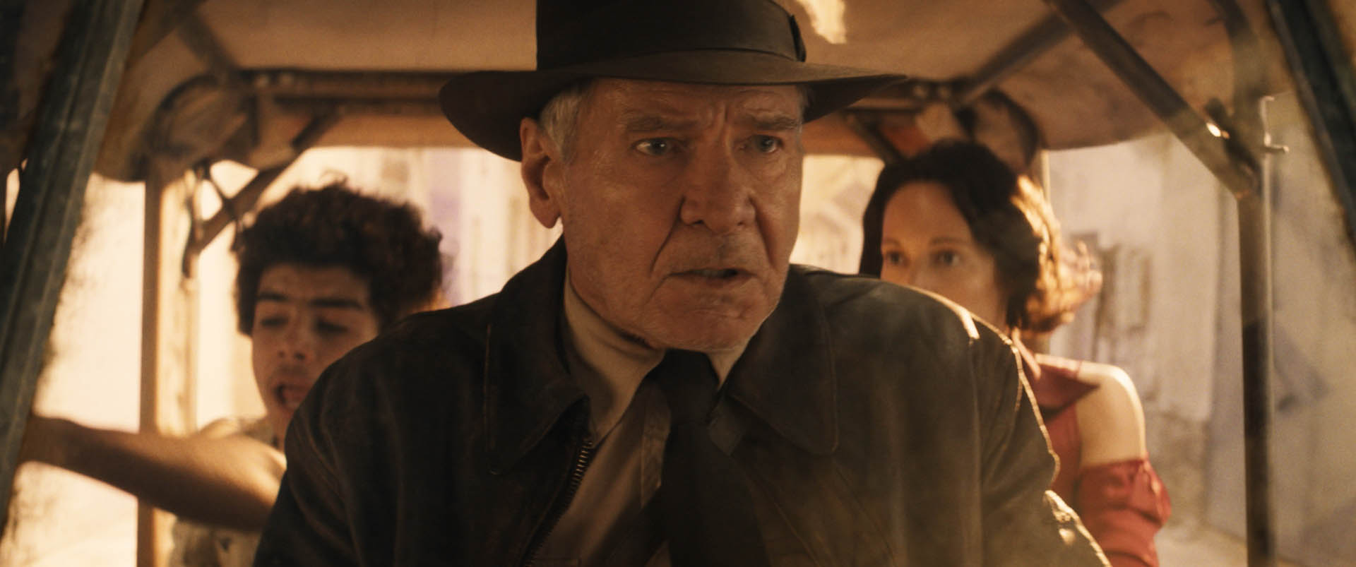 (L-R): Teddy (Ethann Isidore), Indiana Jones (Harrison Ford) and Helena (Phoebe Waller-Bridge) in Lucasfilm's INDIANA JONES AND THE DIAL OF DESTINY.