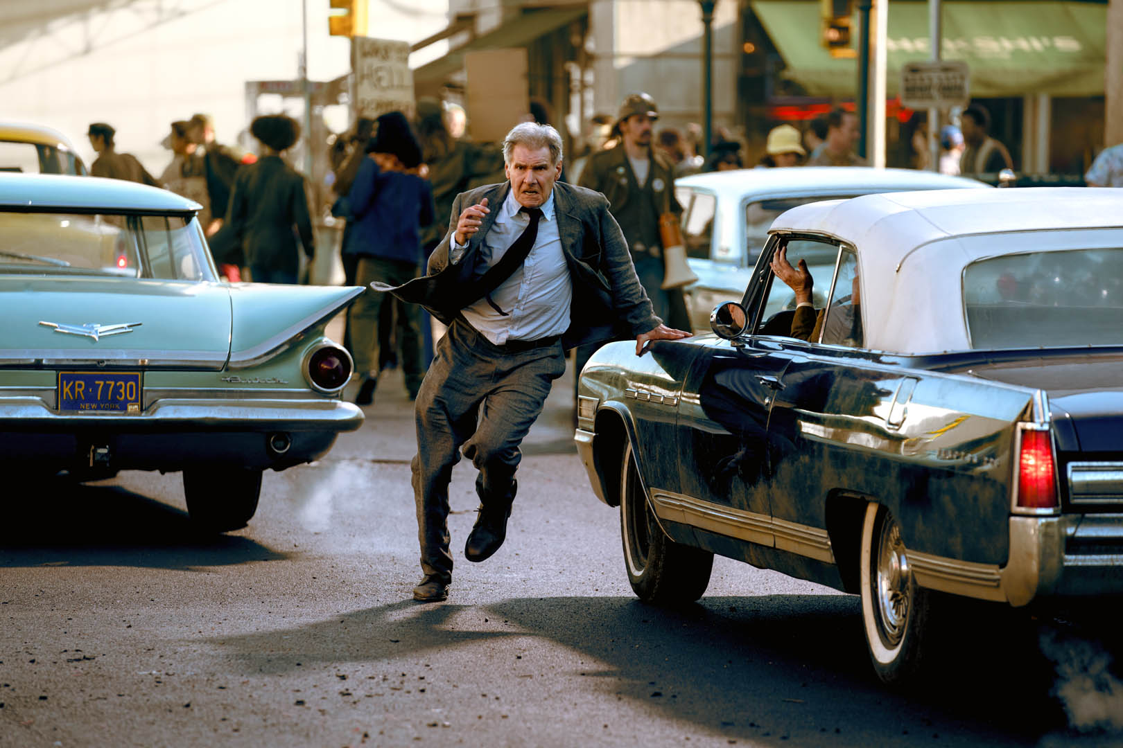Indiana Jones runs through the streets.