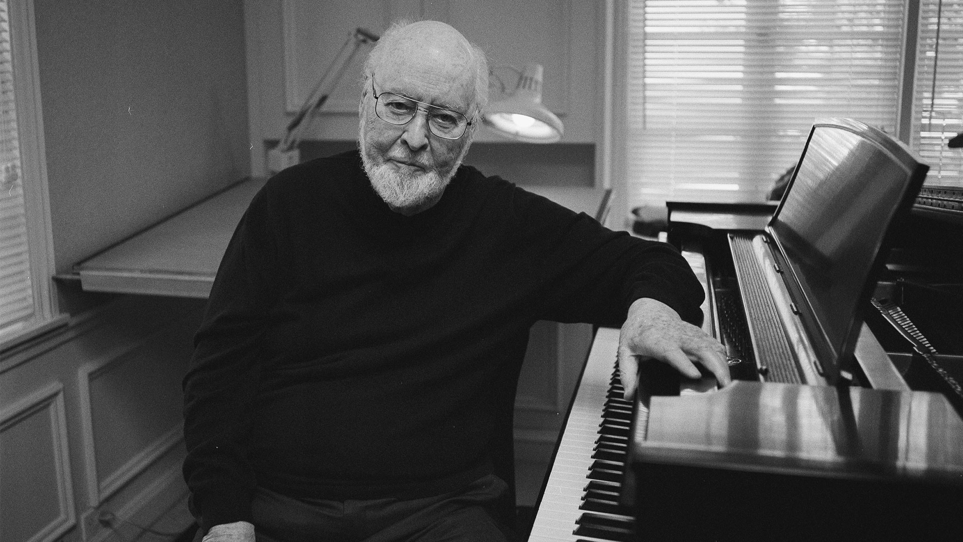 John Williams at the piano.