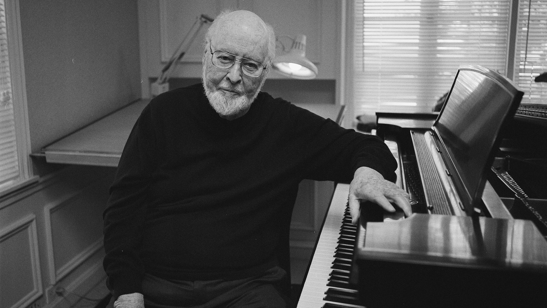 John Williams at the piano.