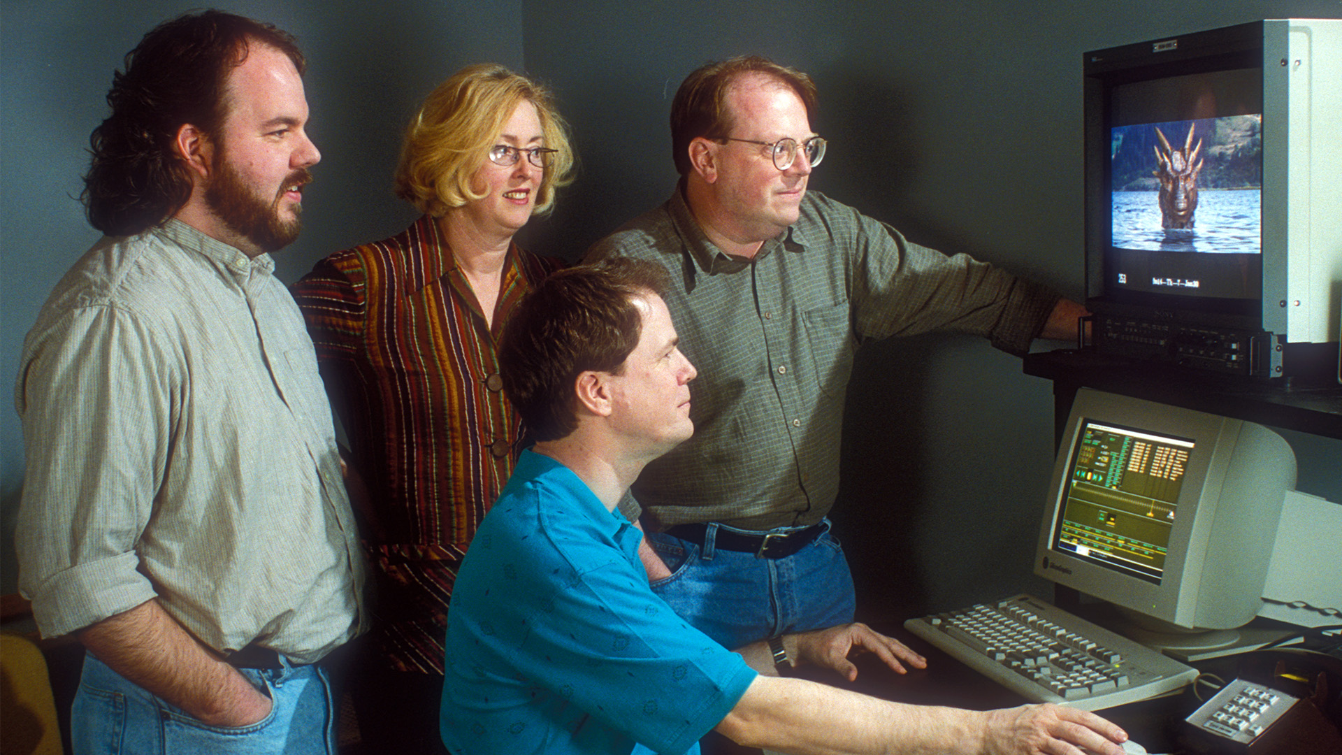ILM visual effects crew looks at a computer for Dragonheart.