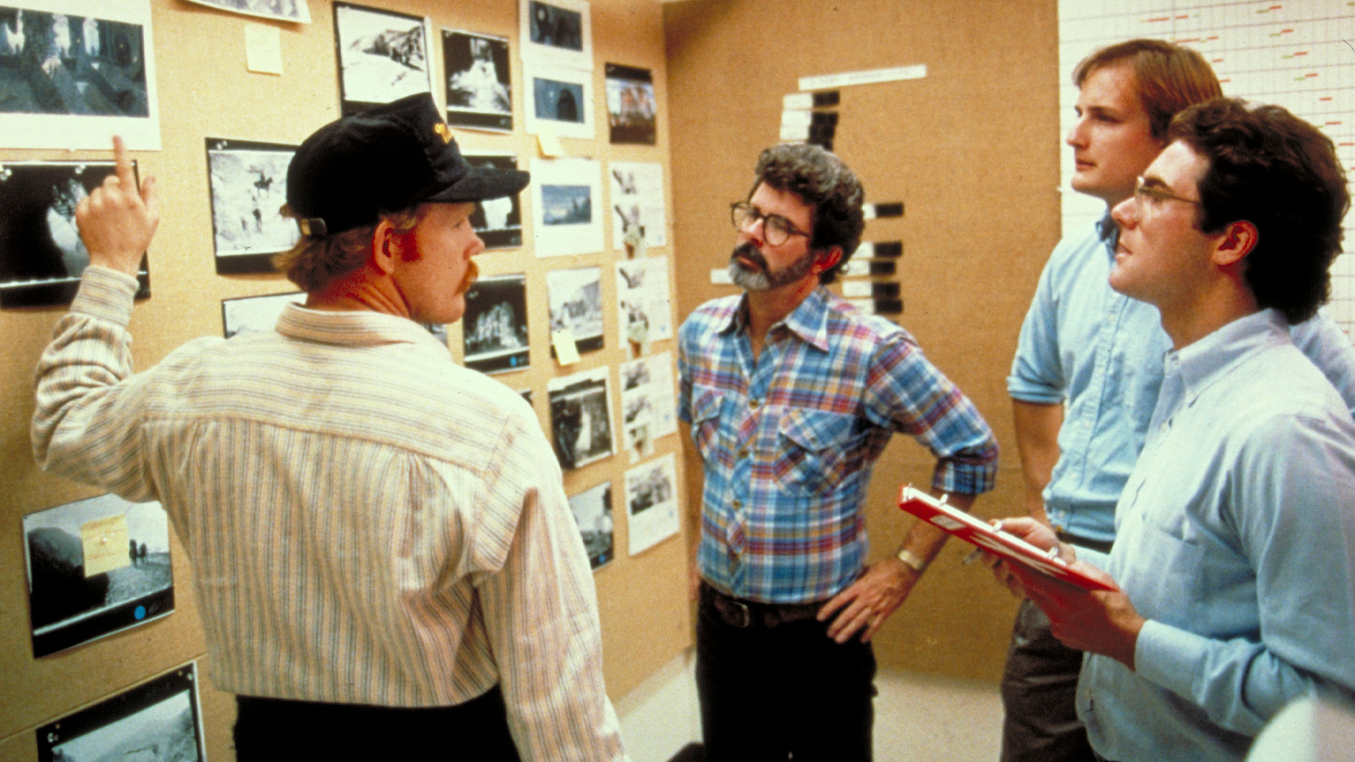 Ron Howard and George Lucas looking at picture from the set of Willow