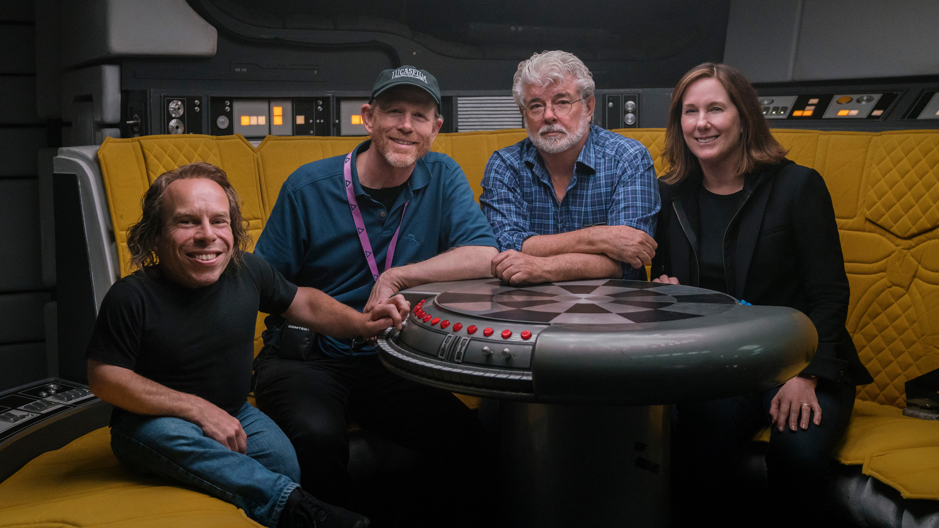 Warwick Davis, Ron Howard, George Lucas, and Kathleen Kennedy on the set of the Falcon