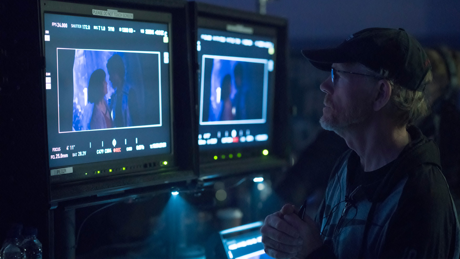 Ron Howard looking at a scene on the set of Solo