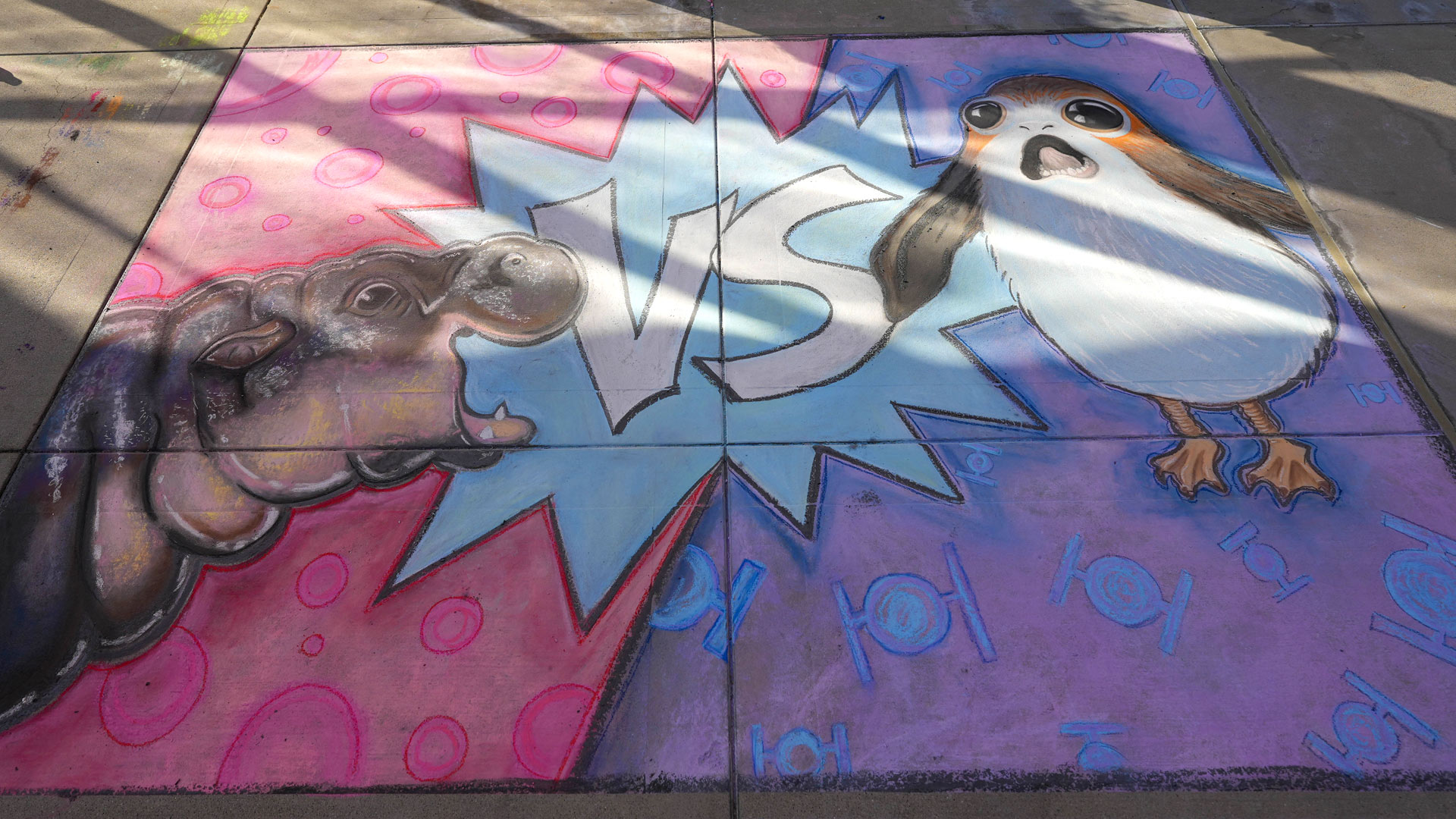 Chalk art of Moo Deng and a porg from Lucasfilm’s Sidewalk Chalk Art Festival 2024.