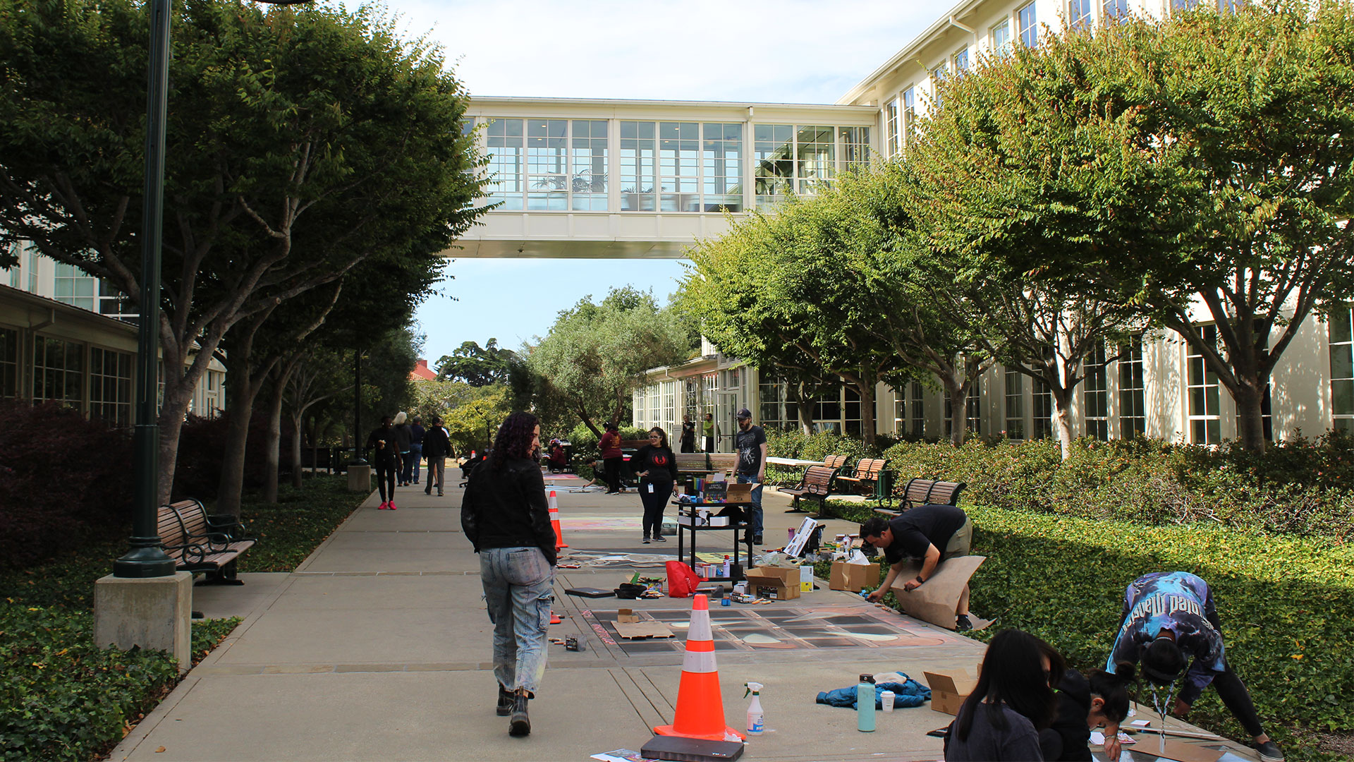 Employees creating art work at the Lucasfilm sidewalk chalk festival.