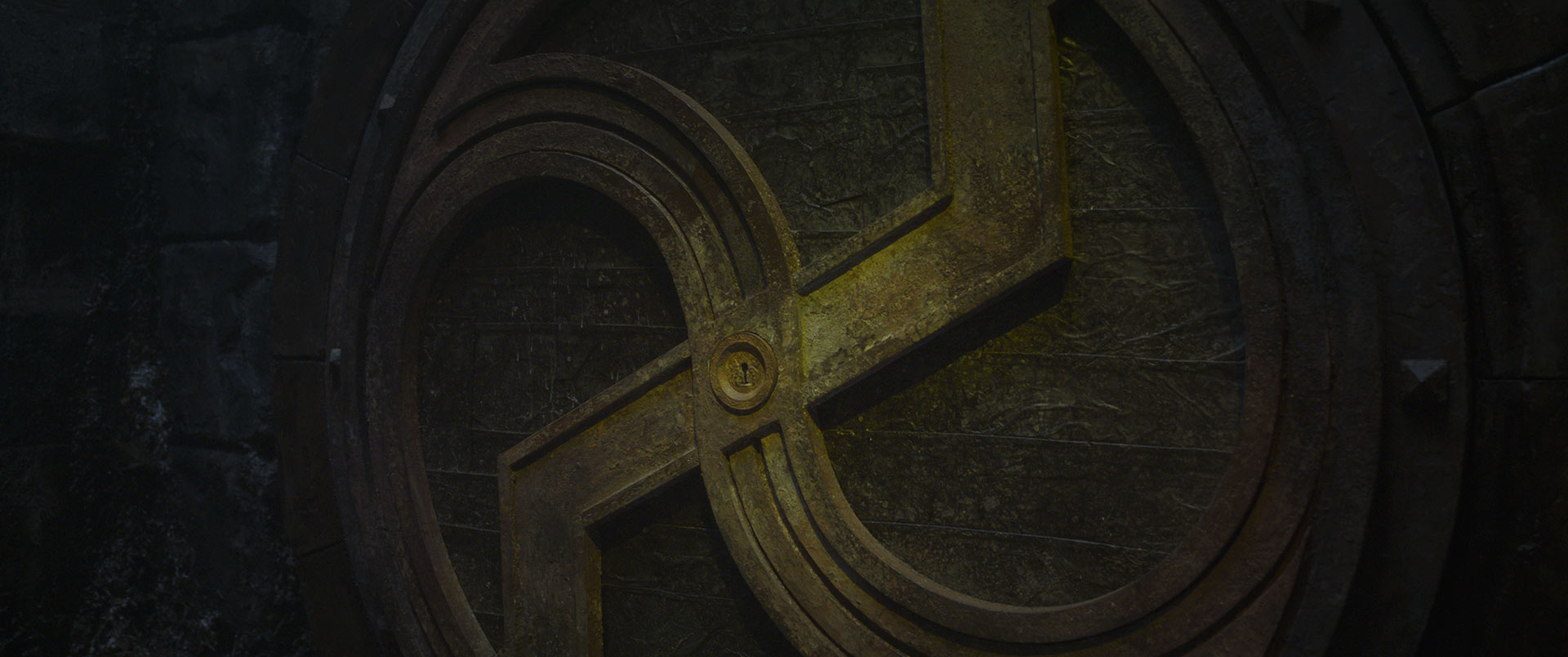 The bronze symbol on the vault door